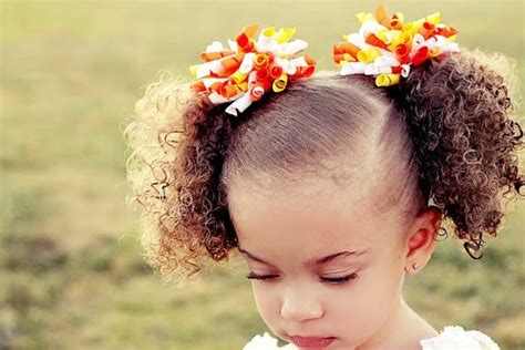 Conceal the hair tie with a floral scarf and your bun is ready to make an entrance at brunch. Curly Hairstyles for Little Girls - How To Style ...