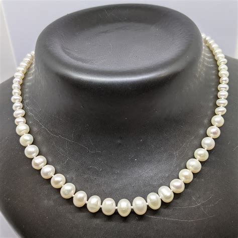 Lovely 16 Inch Graduated Oval Freshwater Pearl Necklace On Sterling