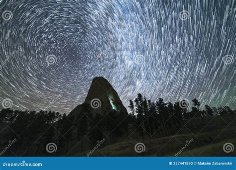 Star Trails Over Devils Tower Butte At Night Light Flare Of Climbers