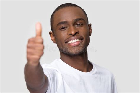 Close Up Smiling Happy African American Man Showing Thumbs Up Stock