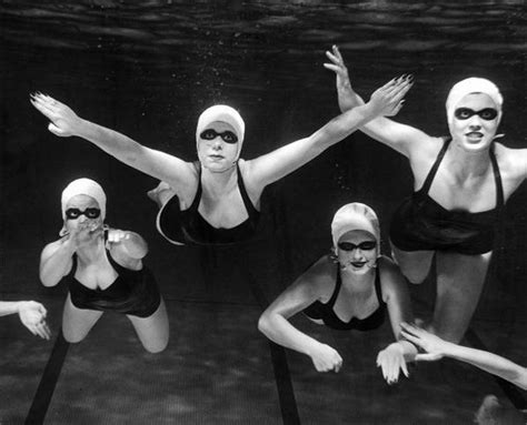 Members Of The Loreleis The Womens Swim Team Swimming In An Underwater Pattern During The