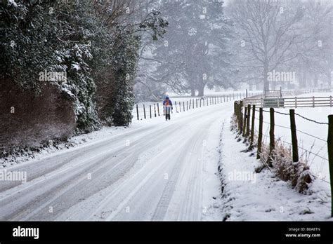 Walking In Snow Storm Yorkshire England Stock Photo Alamy
