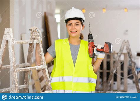 Portrait Of Young Woman Builder With Drill Stock Image Image Of