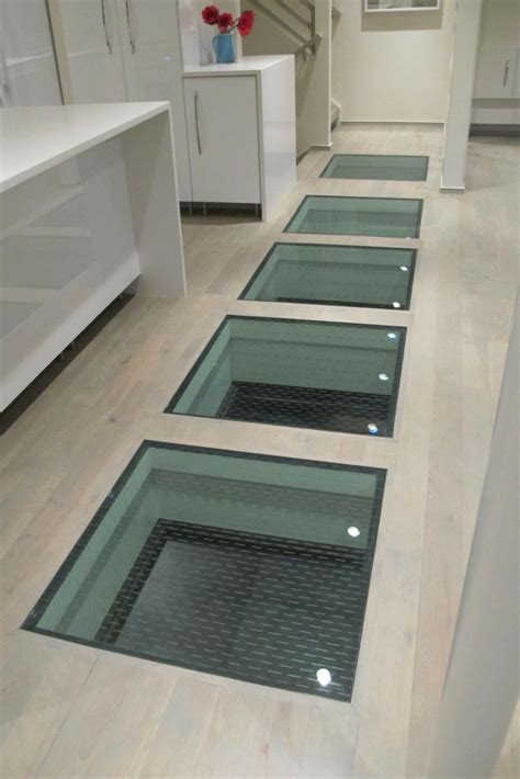 How To Use Glass Floor Panels To Connect Spaces In A Custom Home