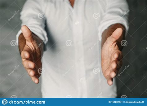 Close Up Of Man`s Cupped Hands Show Something On White Background