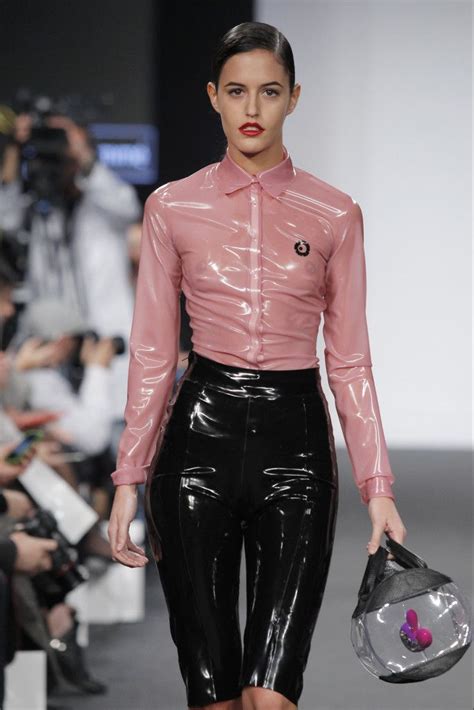 Semi Transparent Pink Latex Button Up Blouse Matched With Black Capri
