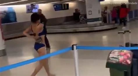 woman arrested after stripping at the airport and casually walking through baggage claim small