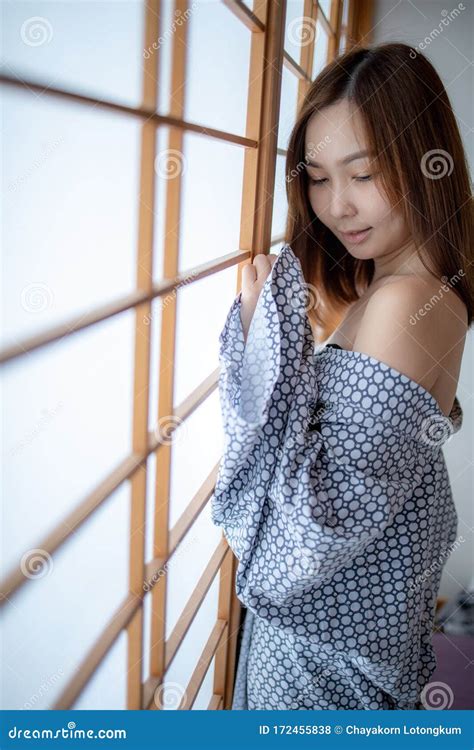 Girl Wearing Yukata On Lower Body And Nude On Upper Stock Photo Image Of Clothes Black