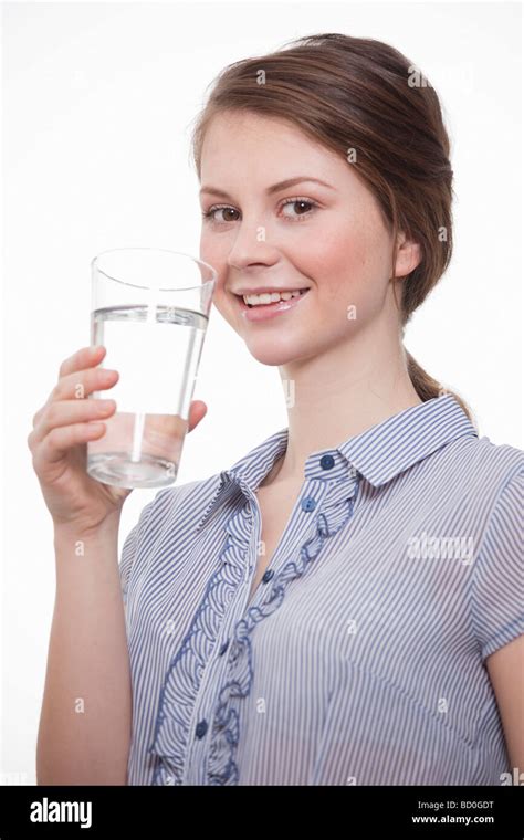 Young Women Holding A Glass Of Water Stock Photo Alamy