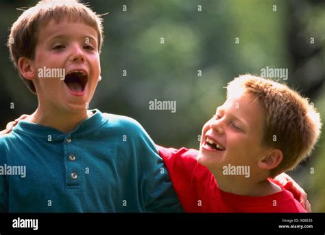 Two Boys Laughing And Smiling Together Stock Photo Alamy