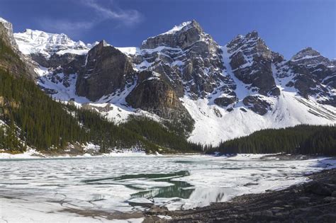 Valley Of Ten Peaks Above Frozen Moraine Lake In Banff National Park