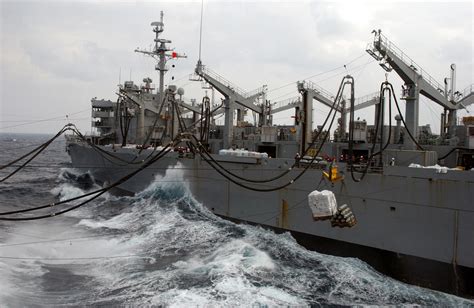 The Fast Combat Support Ship Uss Sacramento (aoe 1) Sends Cargo Over ...