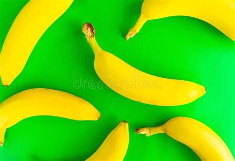 Pattern Background Of Fresh Yellow Bananas On A Green Backdrop View