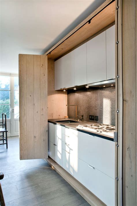 But i was wondering if it is possible to have this feature with frameless full overlay cabinets? Disappearing Act: 14 Minimalist Hidden Kitchens - Remodelista