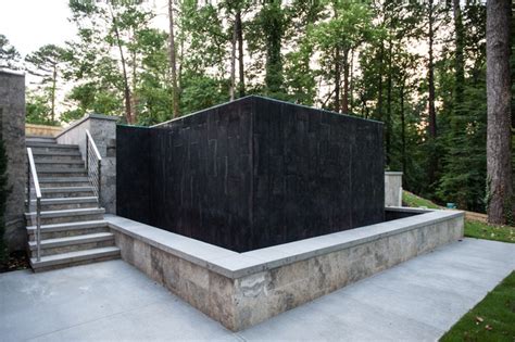 Thoughtful design details enhance the public. Buckhead Steep Slope Infinity Pool with Seat Wall & Fire ...