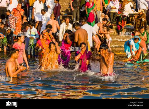 Pilgrims Are Taking Bath In The Holy River Ganges At Dashashwamedh Ghat