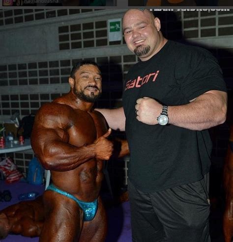 A Professional Strongman Next To A Professional Bodybuilder R