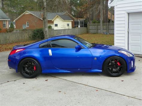 2003 Daytona Blue 350z Touring Nismo 2009 Platinum Graphite 370z