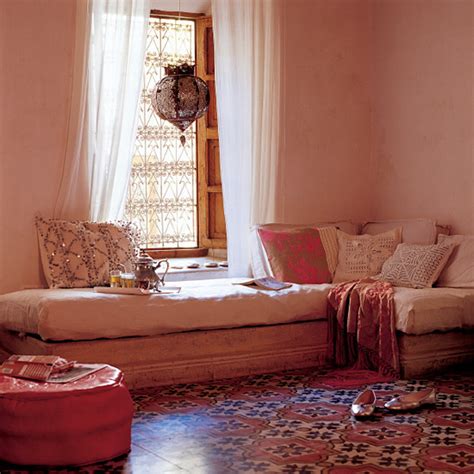 A bright red carved bed adds a moroccan feel to the colorful bedroom. Moroccan Inspired Interior Design Part II