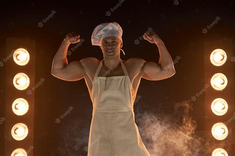 Premium Photo Portrait Of Muscular Chef Wearing White Apron And Chef Hat Showing Strong