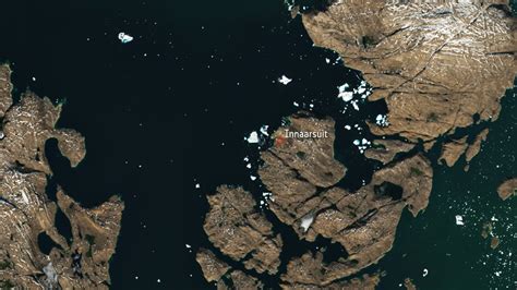 Iceberg Looming Over Greenland Village Spotted From Space