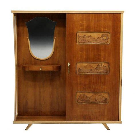 Compact and cute, this console table comes with two drawers that permits you to stow away articles of interest easily. Italian Mid-Century Modern Entryway Coat Cabinet | Chairish