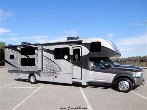 Recreation vehicle on ram chassis powered by 3.6l v6 280hp gas engine. 2017 New Dynamax Corp ISATA 5 35DB 4X4 Super-C Bunkhouse ...
