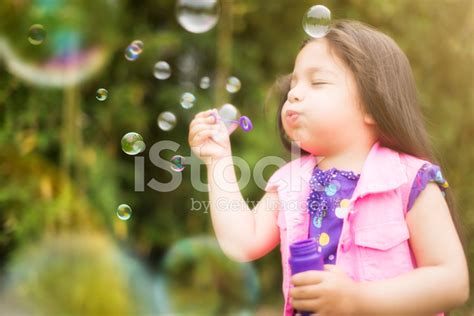 Cute Little Girl Blowing Bubbles Stock Photo Royalty Free Freeimages