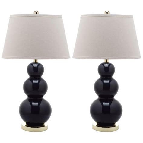 A few brass accents like these pretty lamps and h&m accessories completed the entire look. Safavieh Pamela 27 in. Navy Triple Gourd Ceramic Lamp (Set of 2)-LIT4095B-SET2 - The Home Depot