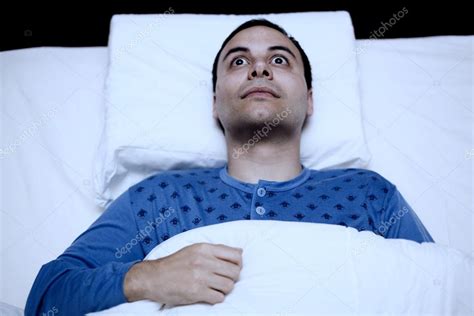 Insomniac Man Trying To Sleep — Stock Photo © Minervastock 63268973