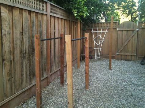 These three overhead bars are set at different heights, so that everyone will be able to find one that is a comfortable and accessible height for them. Back Yard pull up/dip station | DIY Crossfit | Pinterest