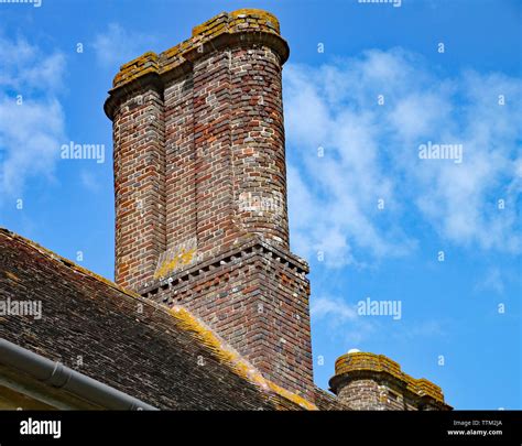 An Old Brick Chimney Stack Atop An Old English House Stock Photo Alamy