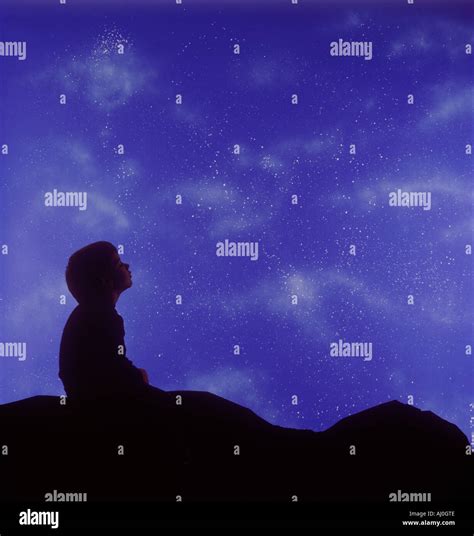 Child Looking At Night Sky Stock Photos And Child Looking At Night Sky