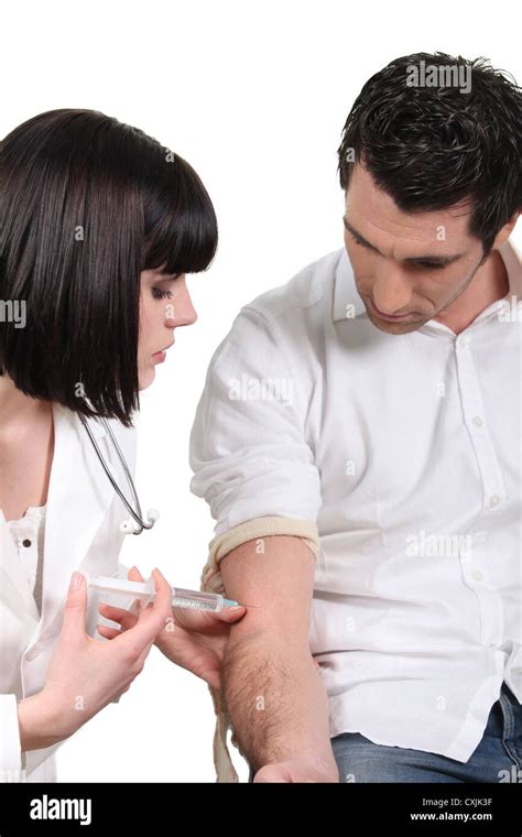 Doctor Giving Her Patient A Shot Stock Photo Alamy