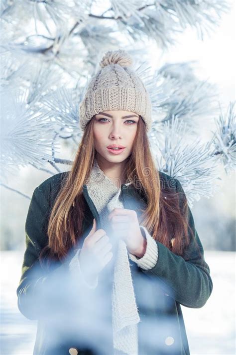 Beautiful Winter Portrait Of Young Woman In The Snowy Scenery Stock