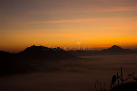 Beautiful Sky Sunrise Mountain Layer In Morning Sun Ray And Winter Fog