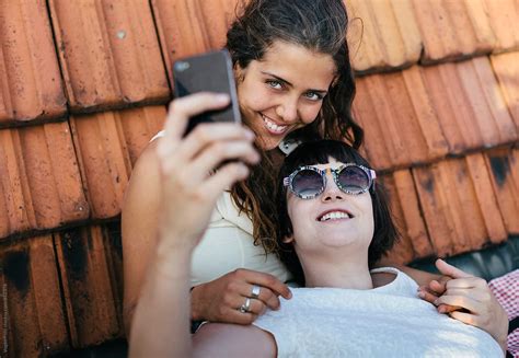Young Women Taking Selfies Together By Stocksy Contributor