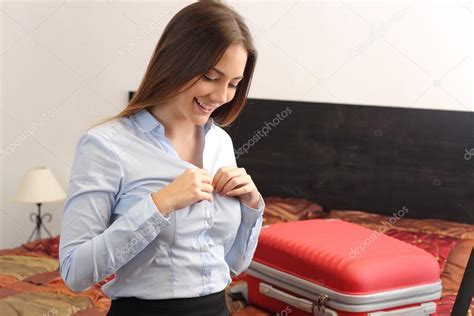 Business Woman Traveler Undressing In A Hotel Room Stock Photo Antonioguillemf