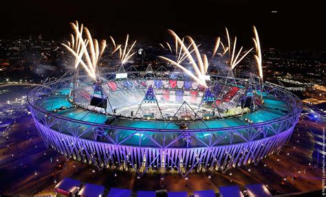 fireworks explode over the olympic stadium during the opening ceremony of the london 2012