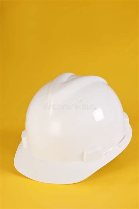 White Safety Helmet For The Site Engineer At The Construction Site