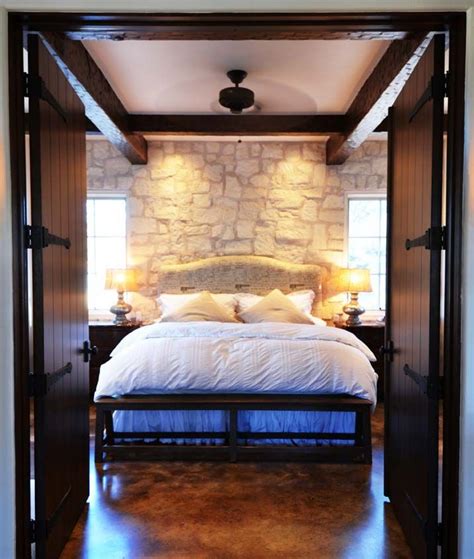 Bedroom With Stone Wall In Fredericksburg Cottage Bonterra Building