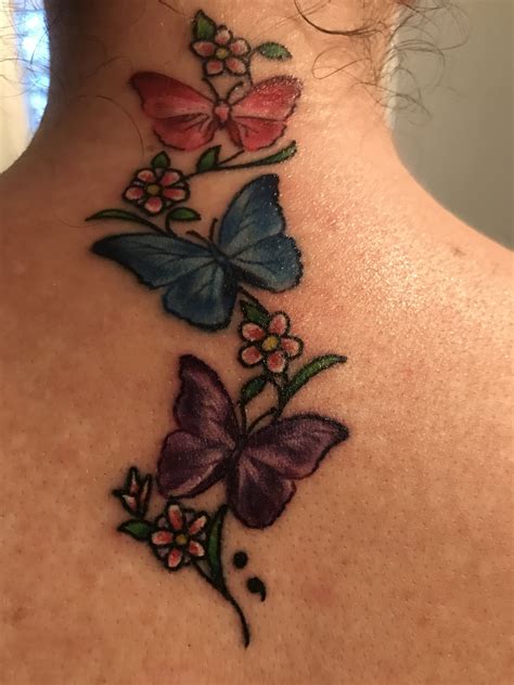 Beautiful New Butterfly Tattoo On The Back Of My Neck With Flowers And