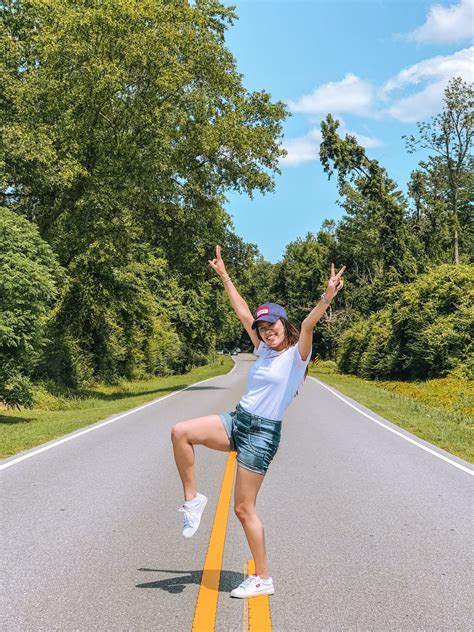 Happy Young Woman On Road In Countryside · Free Stock Photo