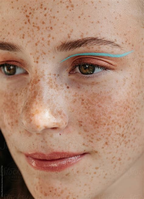 Face Of Young Freckled Woman With Makeup By Liliya Rodnikova Stocksy