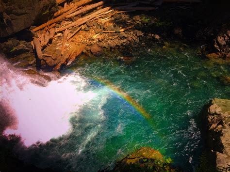Clear Water And Colorful Rocks And Rainbow At Silver Falls Mt Rainier
