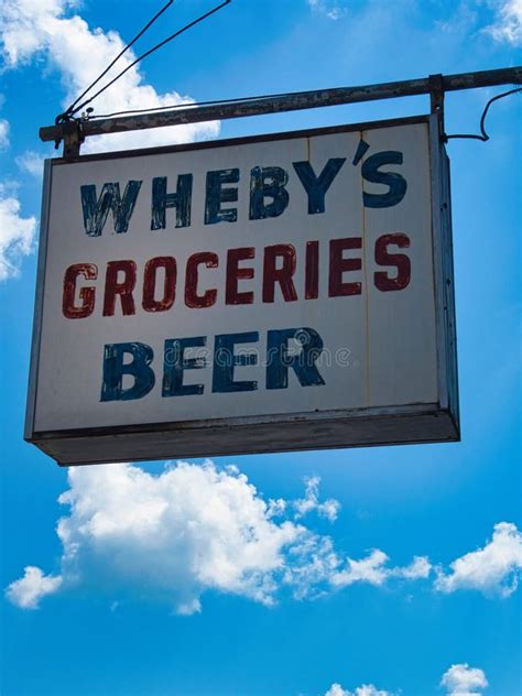 Vintage Grocery Sign With Sky Background Editorial Photography Image