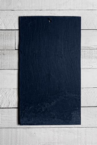Blank Slate Chalk Board Hanging On Shiplap Wall Vertical Image With