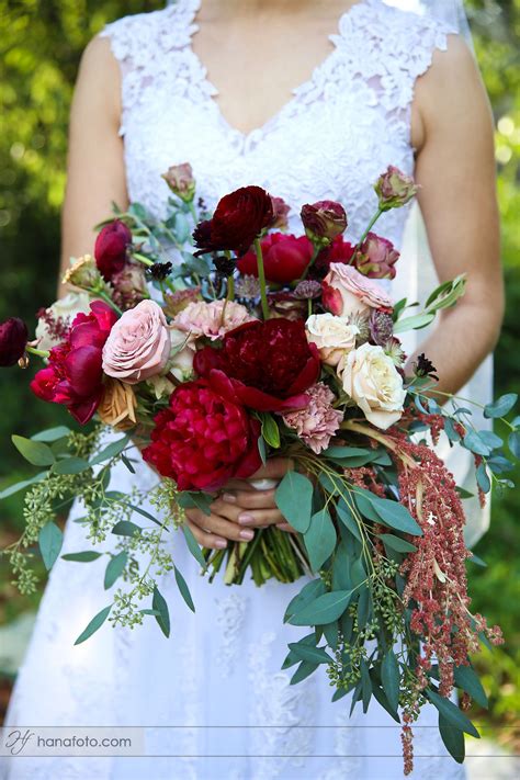 Cascading bouquets are having a bit of a moment right now. burgundy marsala peony cappuccino rose eucalyptus cascade ...