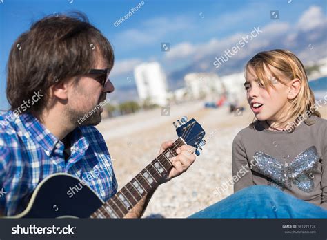 Father Daughter Singing Song On Beach Stock Photo 361271774 Shutterstock
