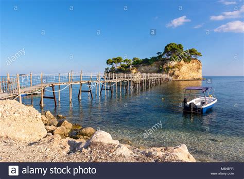 Wooden Bridge From Agios Sostis Leading To Small Rocky Island Bay Of